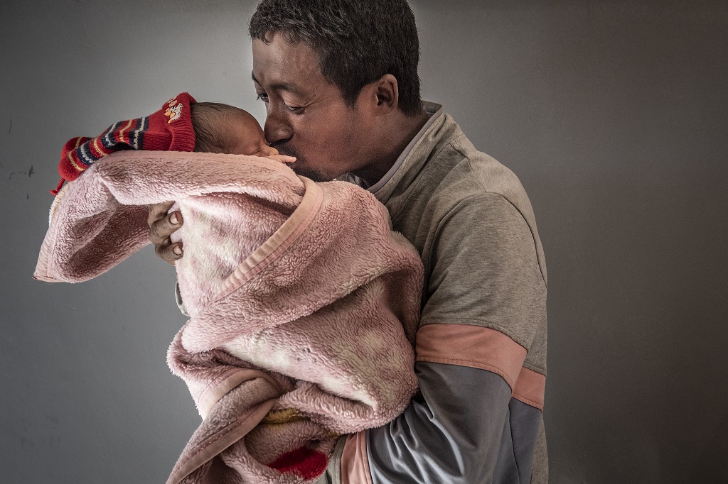 Father kissing baby
